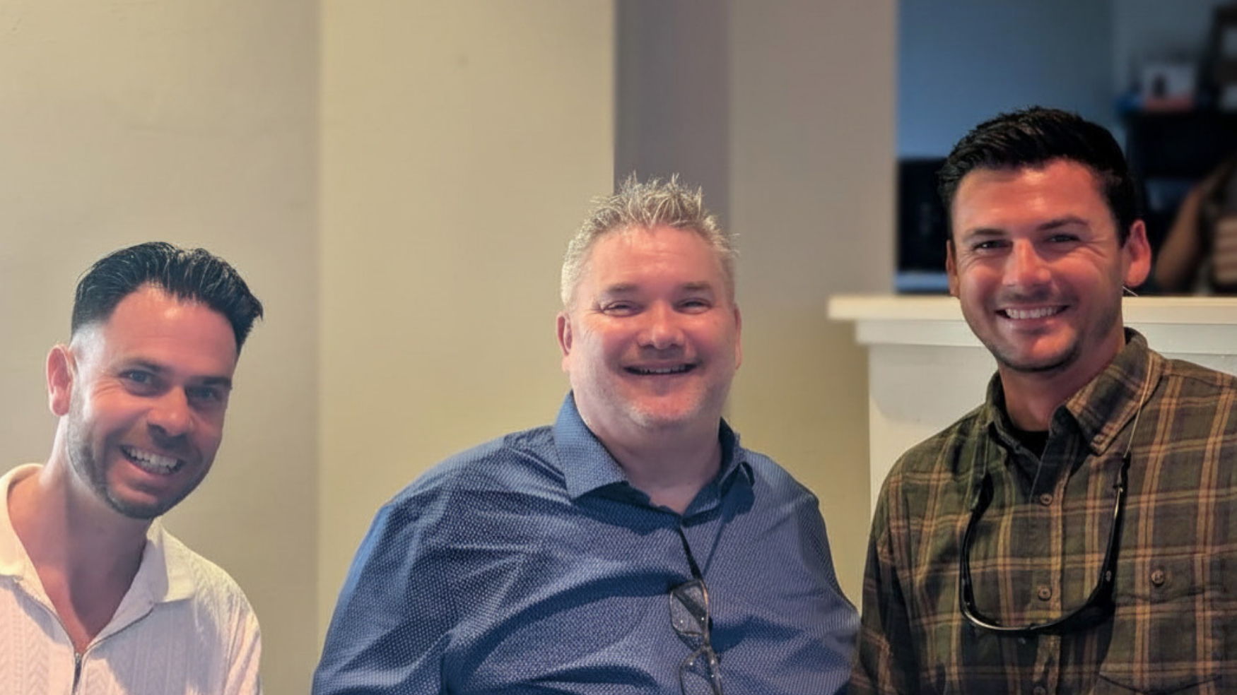 Men smiling together in the church fellowship area