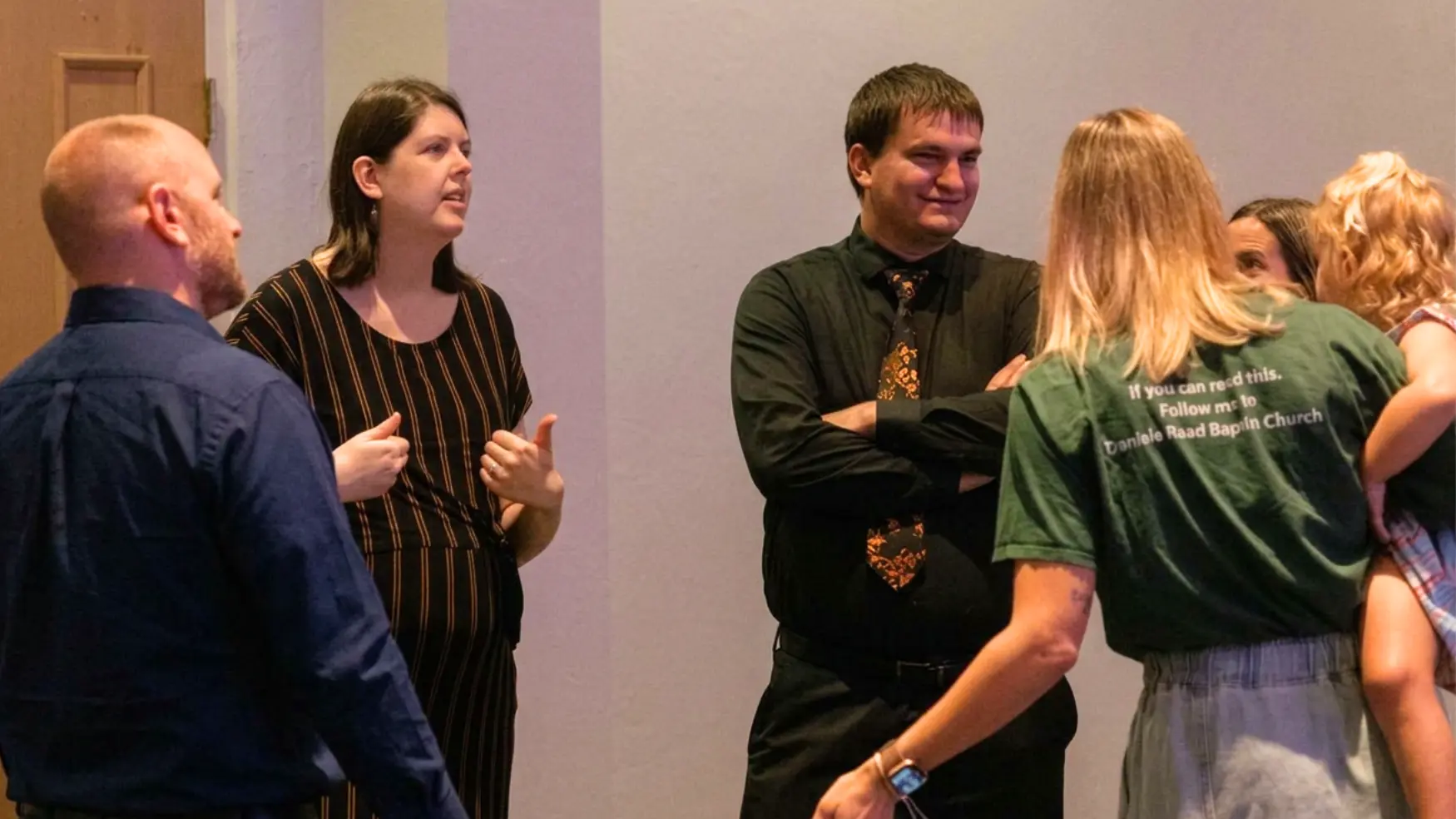 Church family visiting together after a service